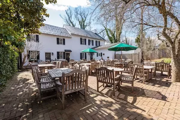 Hunters Head Tavern, a historic English-style pub in Middleburg serving farm-to-table cuisine with cozy indoor dining and a charming outdoor patio.