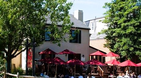 Exterior of Red Horse Tavern in Middleburg, Virginia, a local favorite for hearty American classics. Guests can dine indoors or on the welcoming patio with views of town, making it a go to lunch stop during wine country tours